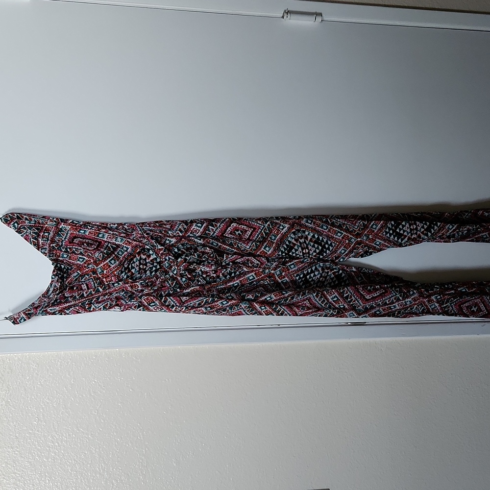Long jumpsuit, rayon ethnic print white, berry,green with black accent.